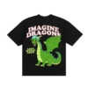 A black T shirt featuring a large colorful graphic on the back The design showcases a friendly green cartoon dragon with blue hair and wings spread wide Above the dragon IMAGINE DRAGONS is written in bold stylized text while LOOM WORLD TOUR appears in a smaller yellow font on the side The T shirt has a classic crewneck and short sleeves making it a stylish and comfortable choice for fans