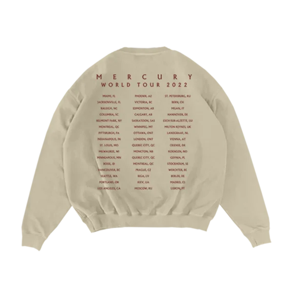 Back of a beige Imagine Dragons crewneck sweatshirt featuring Mercury World Tour 2022 text with a list of tour locations in red