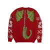 Back of a red holiday sweater featuring green dragon wings a spiked tail and a spine design Snowflakes and festive patterns on the sleeves