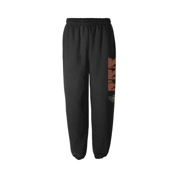 Black ENEMY SWEATPANTS featuring a unique side graphic print with abstract brown and beige elements Comfortable fit with elastic waistband and cuffs