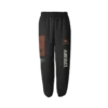 Black sweatpants featuring a unique graphic design with abstract patterns an eye symbol and bold typography Elastic waistband and cuffs