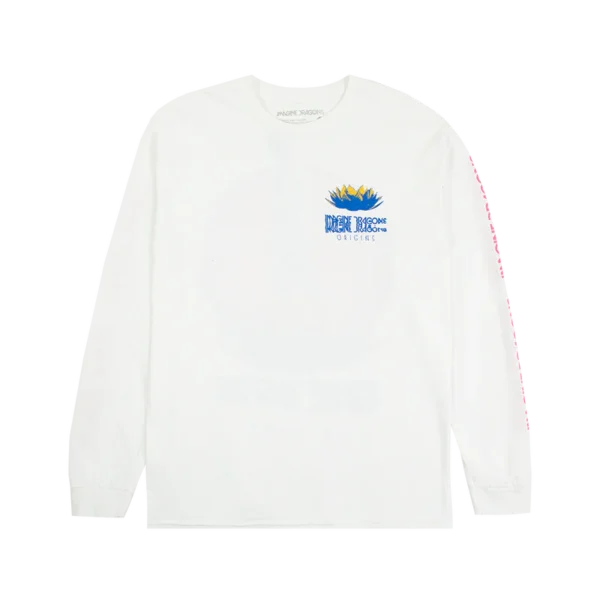 White long sleeve Imagine Dragons Origins shirt featuring a graphic of a person standing on a stylized plant with a pink circular backdrop The bands name Imagine Dragons is displayed in bold blue text below the design with Origins written underneath in a smaller font The sleeves feature repeating pink Imagine Dragons text along their length