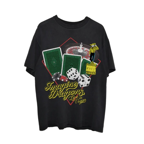 Black Imagine Dragons Live in Vegas t shirt featuring a vibrant casino inspired design with playing cards dice poker chips a roulette wheel and a cowboy figure The bands name is displayed in bold yellow lettering with a retro Vegas style font